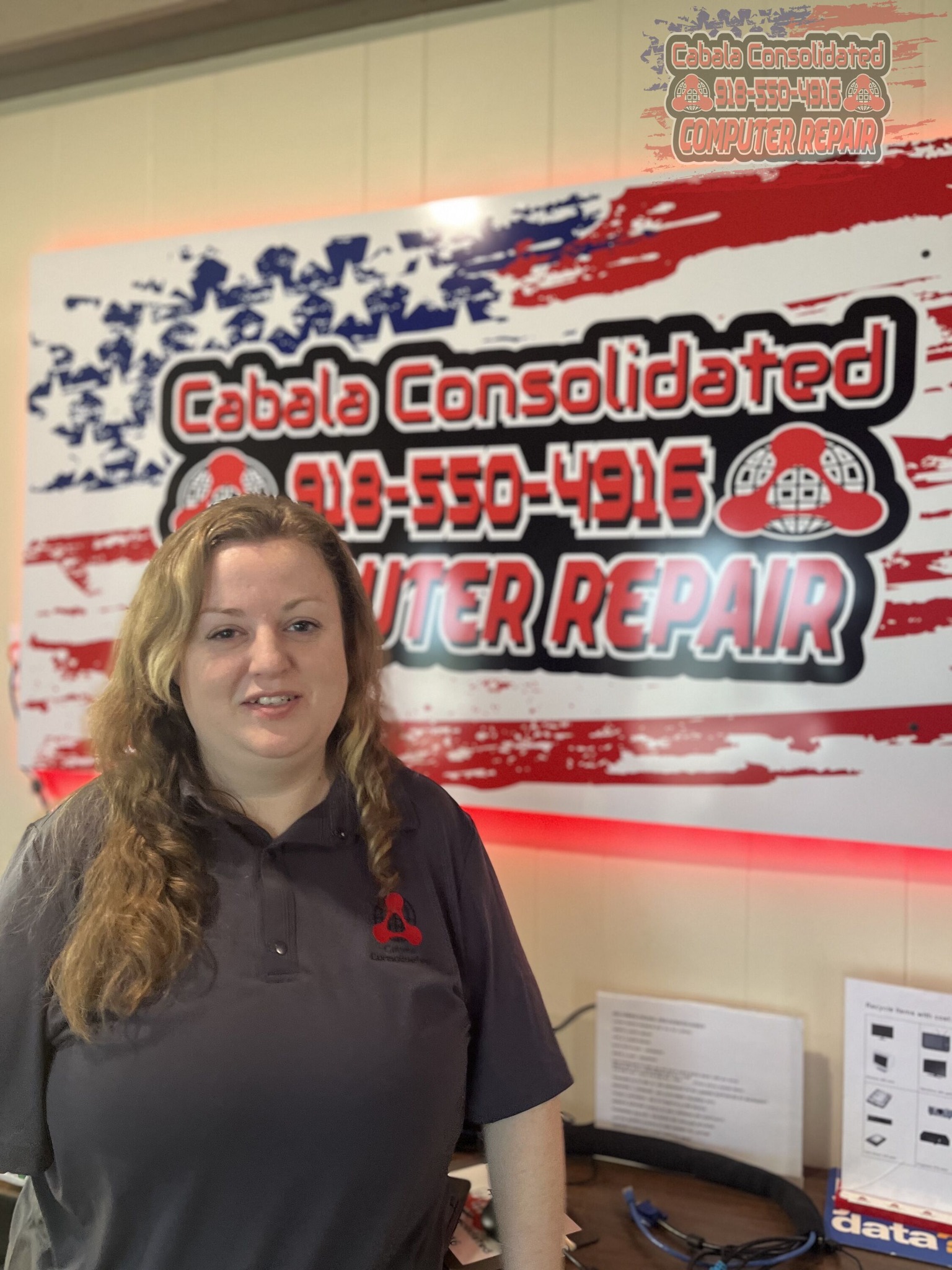 Elizabeth standing in front of the cabala consolidated sign 